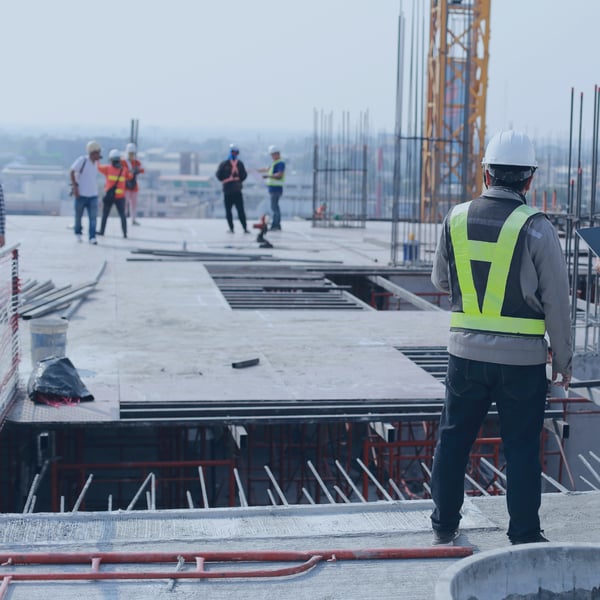 Workers at a construction site representing the building products industry