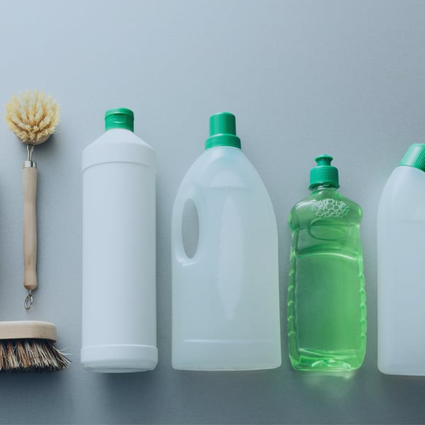 Cleaning spray bottles and supplies representing cleaning products industry